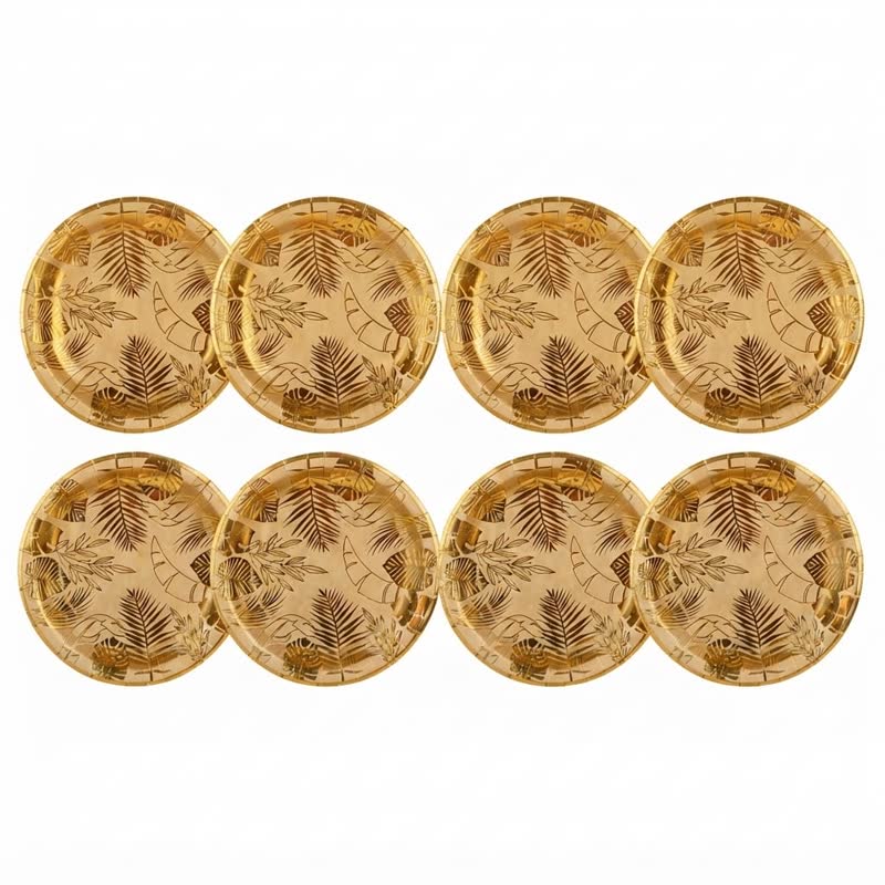 Plato blanco con hojas tropicales doradas